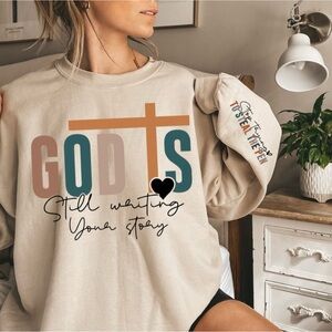 God is still writing your story Beige Graphic Sweatshirt with Inspirational Text